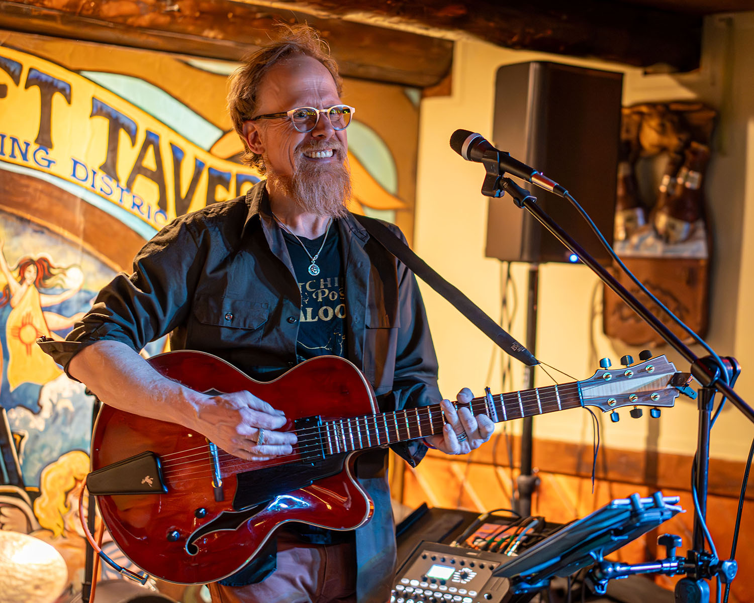 Jonathan Mack playing guitar at the Mineshaft Tavern in Madrid, NM