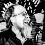 Jonathan Mack Singing, black and white photo