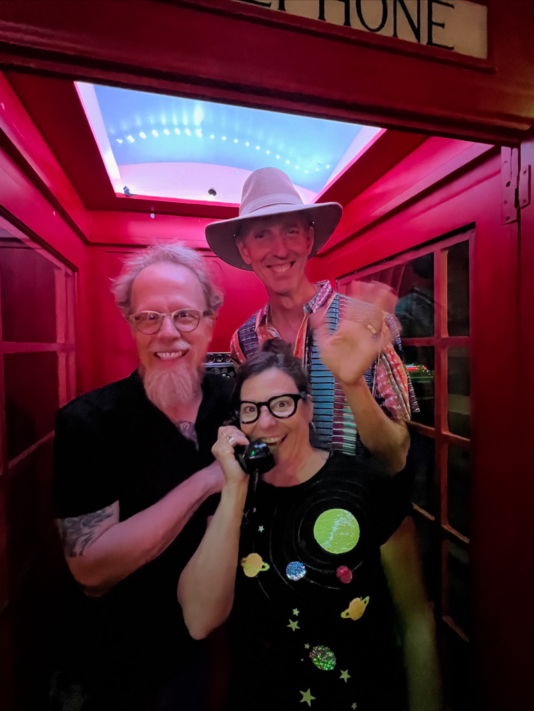 Mineral Hill band members in an English Phone Booth at the Bisbee Social Club.